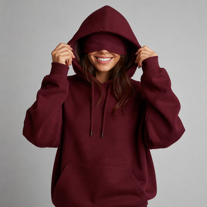 Sleepy Travel Hoodie in Bordeaux, model met hood op en oogmasker naar beneden getrokken