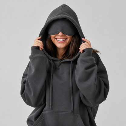 Sleepy Travel Hoodie in Grijs, model met hood op en oogmasker naar beneden getrokken